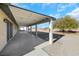 Covered patio with concrete flooring and a view of the backyard at 8870 W Craig Rd, Las Vegas, NV 89129