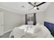 Bedroom with queen bed, gray carpet, and window with curtains at 8870 W Craig Rd, Las Vegas, NV 89129