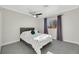 Cozy bedroom with a queen-size bed and a ceiling fan at 8870 W Craig Rd, Las Vegas, NV 89129