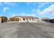 House exterior with a long driveway and detached garage at 8870 W Craig Rd, Las Vegas, NV 89129