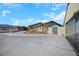 Home exterior with a long driveway and gated entrance at 8870 W Craig Rd, Las Vegas, NV 89129