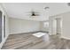 Spacious living room featuring hardwood floors and ceiling fan at 8870 W Craig Rd, Las Vegas, NV 89129