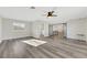 Open living room showcasing hardwood floors and a view to the kitchen at 8870 W Craig Rd, Las Vegas, NV 89129