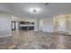 Open living area with kitchen view,tile floors, and recessed lighting at 8870 W Craig Rd, Las Vegas, NV 89129