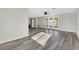 Sunlit living room with hardwood floors and multiple exits at 8870 W Craig Rd, Las Vegas, NV 89129