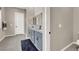 Double vanity bathroom with gray cabinets and walk-in shower at 8929 Cassia Winds St, Las Vegas, NV 89166