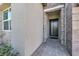 Front entry with modern door and brick-paved walkway at 8929 Cassia Winds St, Las Vegas, NV 89166