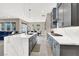 Modern kitchen with island, stainless steel appliances, and gray cabinetry at 8929 Cassia Winds St, Las Vegas, NV 89166