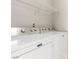 Bright laundry room, featuring a washer and dryer with shelving above at 9000 Las Vegas Blvd # 1016, Las Vegas, NV 89123