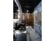 Luxury bathroom with marble walls, modern fixtures, and a rainfall shower at 924 S First St # 406, Las Vegas, NV 89101
