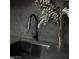 Modern kitchen sink with black matte faucet and stylish backsplash at 924 S First St # 406, Las Vegas, NV 89101