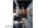 Modern bathroom with sleek dark vanity and patterned floor at 924 S First St # 510, Las Vegas, NV 89101