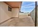 A fenced backyard presents a private outdoor space, with a concrete slab, with plenty of room to customize at 111 Manganese St, Henderson, NV 89015