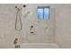 Recently remodeled shower and tub featuring bright tile with a modern shower head at 111 Manganese St, Henderson, NV 89015