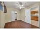 Cozy bedroom featuring wood floors, a ceiling fan, and closet with sliding doors at 111 Manganese St, Henderson, NV 89015
