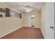 Cozy bedroom featuring wood floors, a ceiling fan, and closet with sliding doors at 111 Manganese St, Henderson, NV 89015