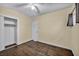 A standard bedroom featuring hardwood floors, closet, and a light neutral paint at 111 Manganese St, Henderson, NV 89015