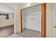 Hall closet featuring wood bi-fold doors, storage shelves, and tile flooring at 111 Manganese St, Henderson, NV 89015