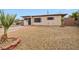 Modest single story home featuring low maintenance landscaping and a neutral exterior paint scheme at 111 Manganese St, Henderson, NV 89015