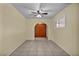 Inviting living room with neutral walls, a ceiling fan, and tile flooring at 111 Manganese St, Henderson, NV 89015