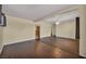 Open-concept living room with hardwood floors, neutral paint, and a ceiling fan for added comfort at 111 Manganese St, Henderson, NV 89015