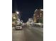 A bustling Water Street District view at night, showcasing shops and hotels lit up along the city street at 111 Manganese St, Henderson, NV 89015