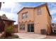 Two story home featuring a backyard patio and a well maintained air conditioning unit at 1158 Safari Creek Dr, Henderson, NV 89002