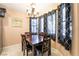 Dining room features a wooden table and chairs at 1321 Cinder Rock Dr # 202, Las Vegas, NV 89128