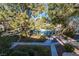 Community pool with a landscaped view surrounded by lush trees and walkways at 1321 Cinder Rock Dr # 202, Las Vegas, NV 89128