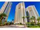 High-rise residential building with palm trees and city views at 135 E Harmon Ave # 3416, Las Vegas, NV 89109