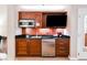 Compact kitchen with microwave, dishwasher, and mini-fridge at 135 E Harmon Ave # 3416, Las Vegas, NV 89109