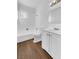 Clean bathroom with white vanity, bathtub, and toilet at 1819 Bassler St, North Las Vegas, NV 89030