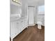 Updated bathroom with white vanity and shower at 1819 Bassler St, North Las Vegas, NV 89030