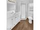Updated bathroom with white vanity and shower at 1819 Bassler St, North Las Vegas, NV 89030