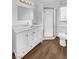 Updated bathroom with white vanity and shower at 1819 Bassler St, North Las Vegas, NV 89030