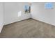 Spacious bedroom with carpeted floors and large window at 1819 Bassler St, North Las Vegas, NV 89030
