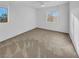 Simple bedroom with carpeted floors and window at 1819 Bassler St, North Las Vegas, NV 89030