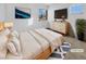 Bright bedroom with a large bed, dresser, and TV at 1819 Bassler St, North Las Vegas, NV 89030