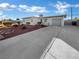 Ranch home with attached garage and driveway at 1819 Bassler St, North Las Vegas, NV 89030