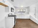 Modern kitchen with white cabinets, and wood flooring at 1819 Bassler St, North Las Vegas, NV 89030