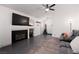 Living room with a fireplace and a large flat-screen TV at 2106 Big Boulder Dr, North Las Vegas, NV 89031