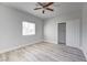 Well-lit bedroom with wood-look floors and closet at 2140 Upland Ave, Pahrump, NV 89048