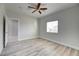 Spacious bedroom with wood-look floors and door at 2140 Upland Ave, Pahrump, NV 89048