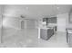 Open concept living room and kitchen with marble floors at 2140 Upland Ave, Pahrump, NV 89048