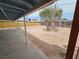 Backyard with a small tree and a covered patio area at 2208 W Washington Ave, Las Vegas, NV 89106