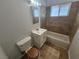 Clean bathroom with tiled floor, tub, and white vanity at 2208 W Washington Ave, Las Vegas, NV 89106
