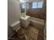 Clean bathroom with tiled floor, tub, and white vanity at 2208 W Washington Ave, Las Vegas, NV 89106