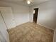 Simple bedroom with tile floors and ceiling fan at 2208 W Washington Ave, Las Vegas, NV 89106
