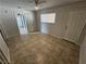 Bright bedroom with tile flooring and mirrored closet doors at 2208 W Washington Ave, Las Vegas, NV 89106
