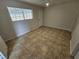 Bright bedroom with tile floors and window at 2208 W Washington Ave, Las Vegas, NV 89106